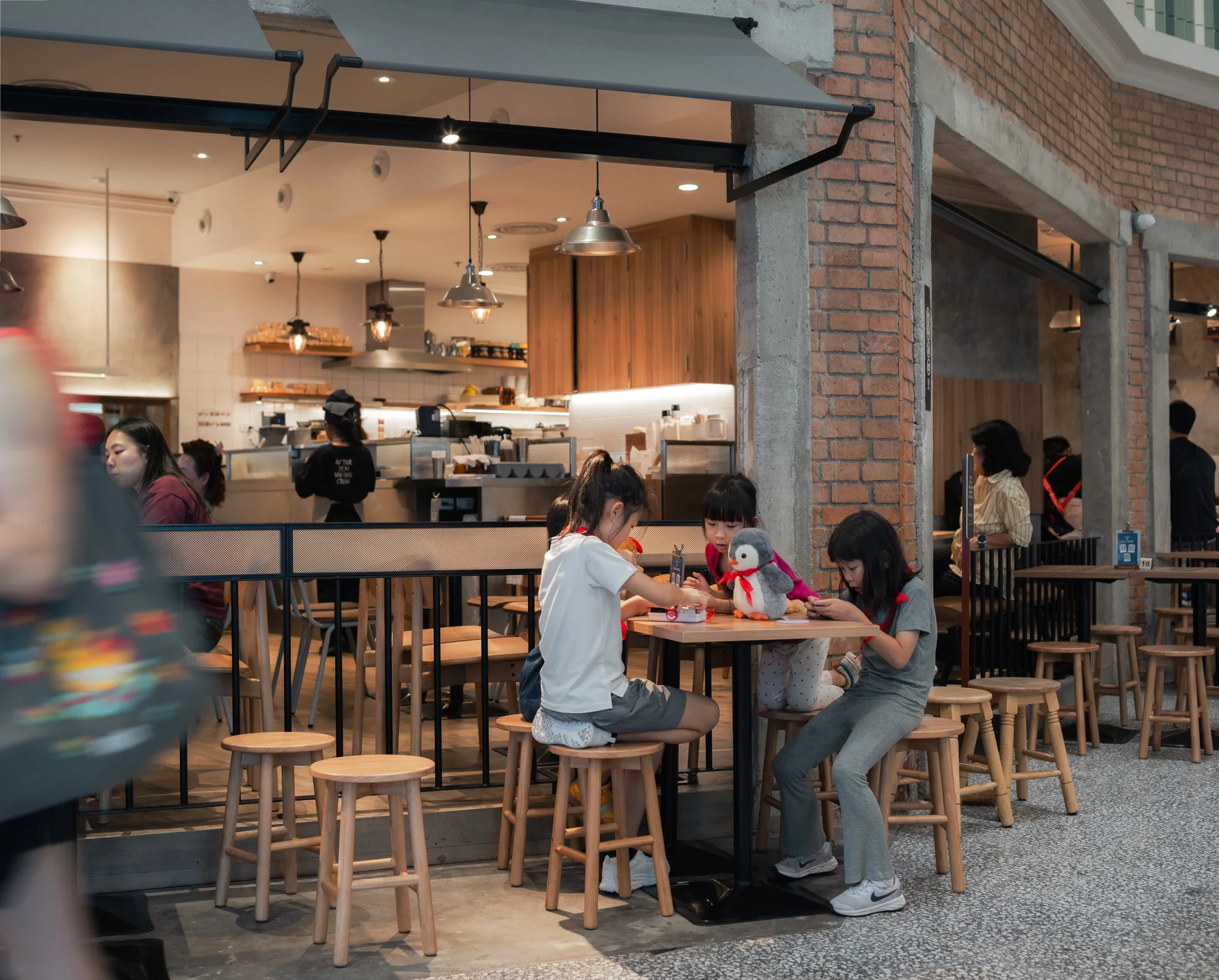 Customers using the open-frontage seating at After You CentralWorld.