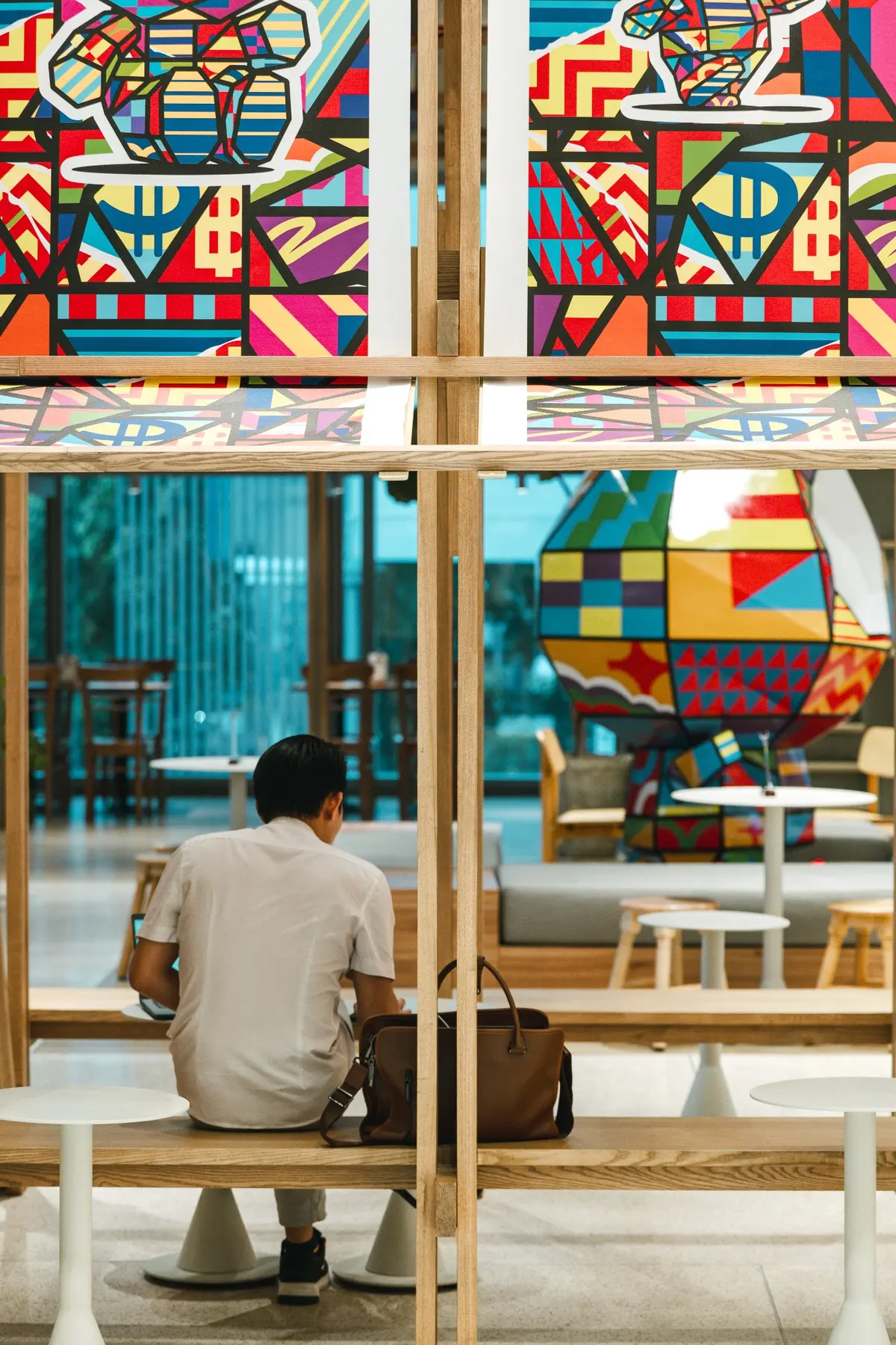 Artwork and sculpture beside cafe seating