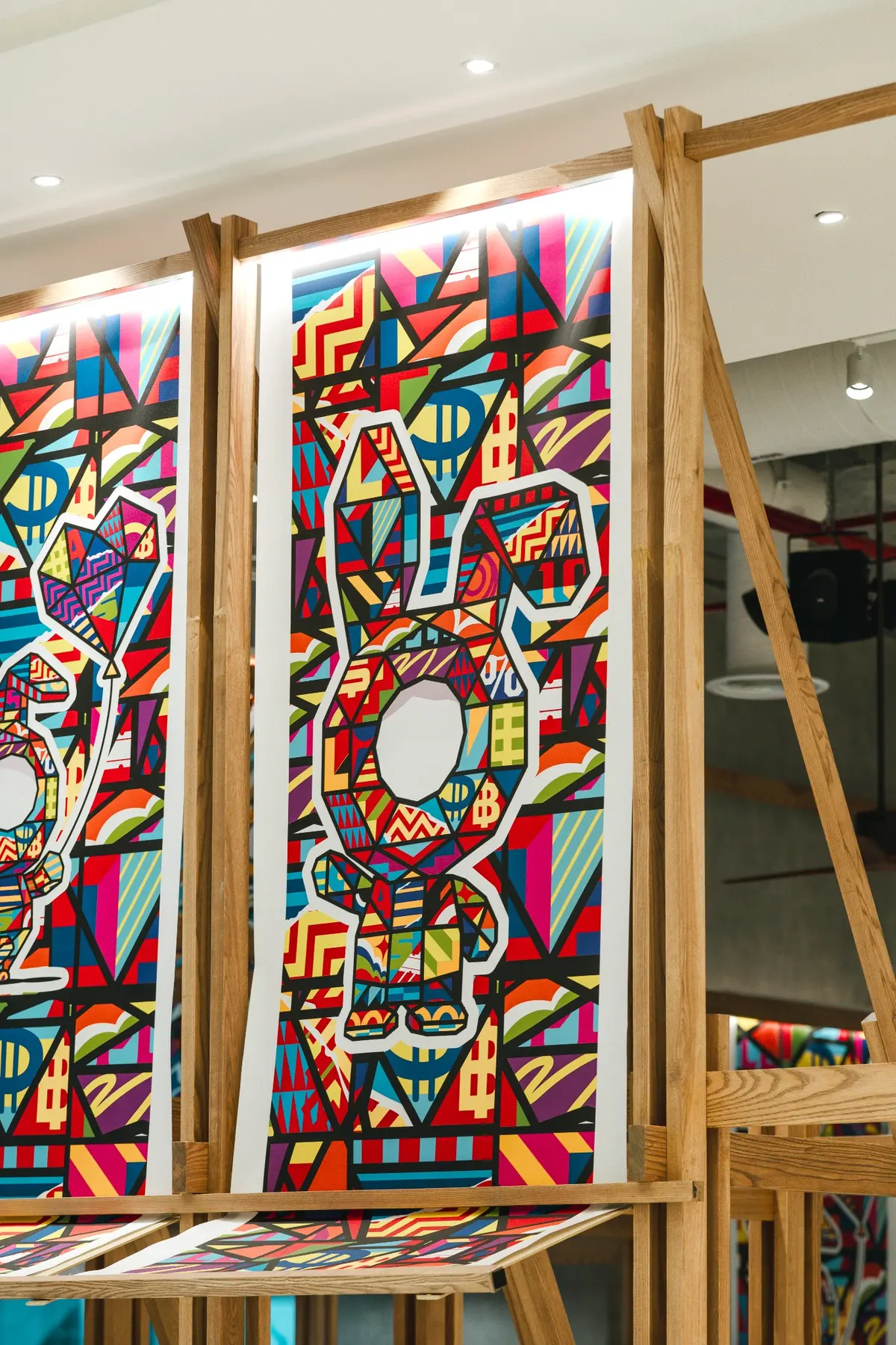 Tall artwork panels integrated with timber posts