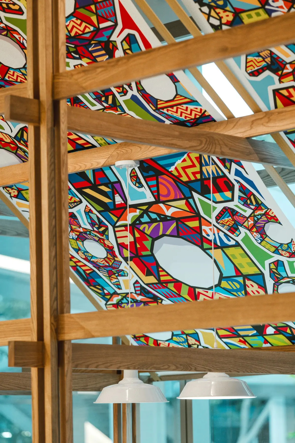 Artwork seen through the timber structural grid