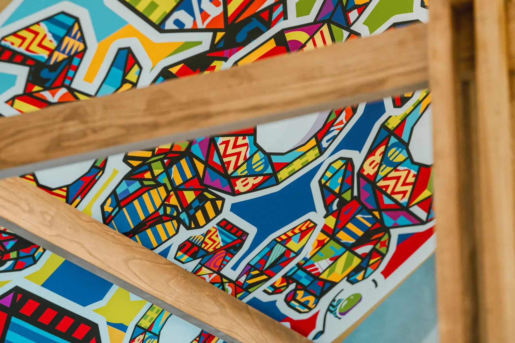 Close detail of colorful artwork and timber members