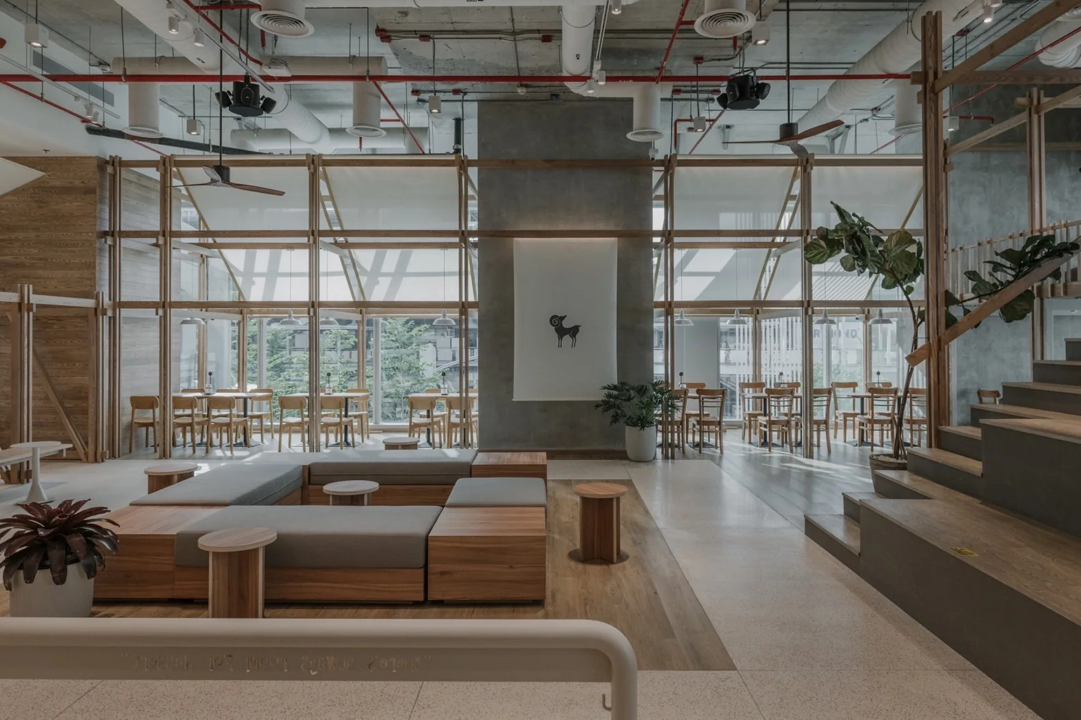 Central lounge and window seating at After You Unicorn Building