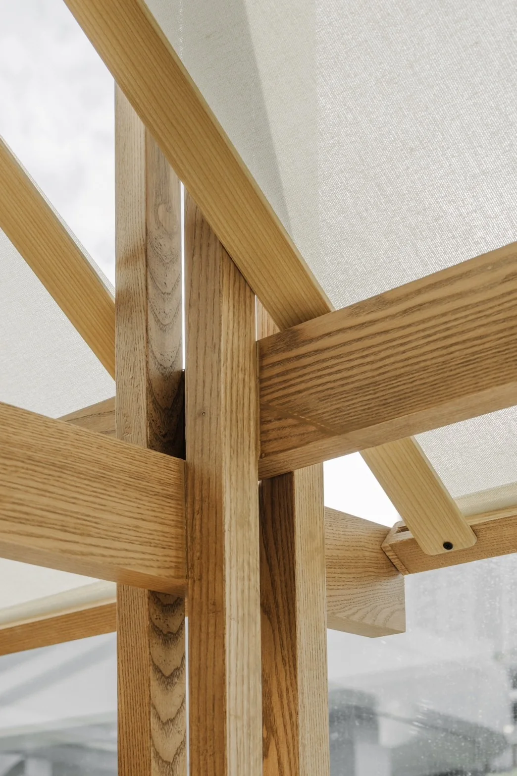 Close-up of timber joint and translucent canopy