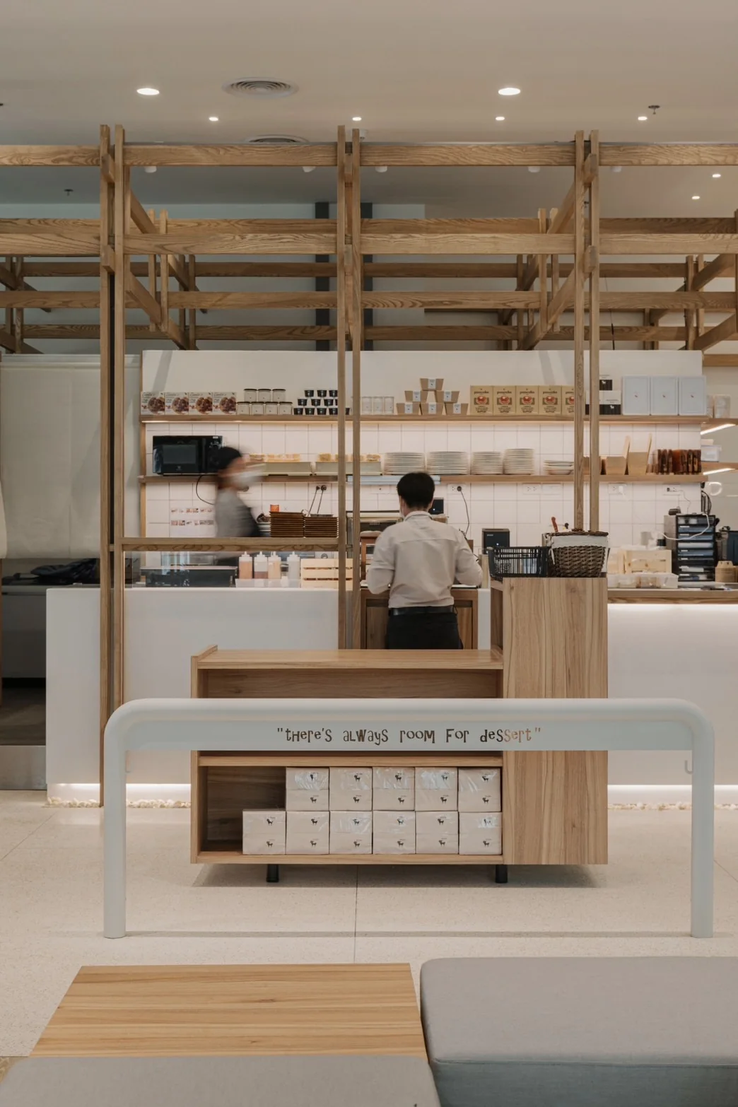 Cafe counter seen through the timber framework