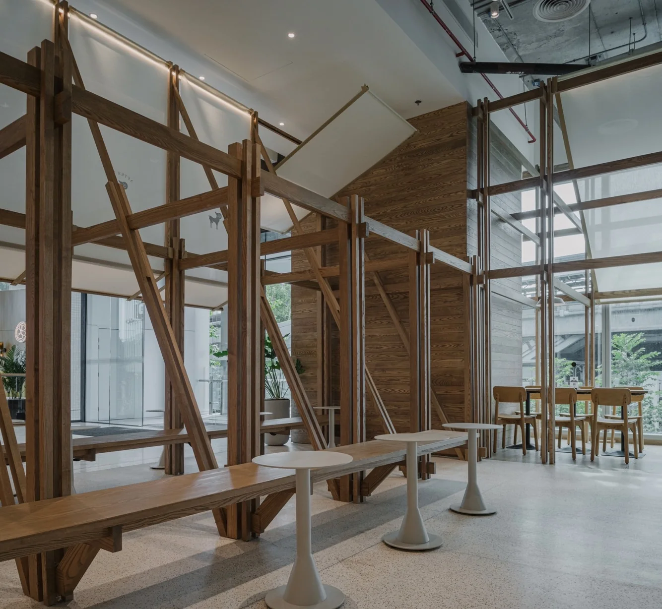 Long timber bench and small tables