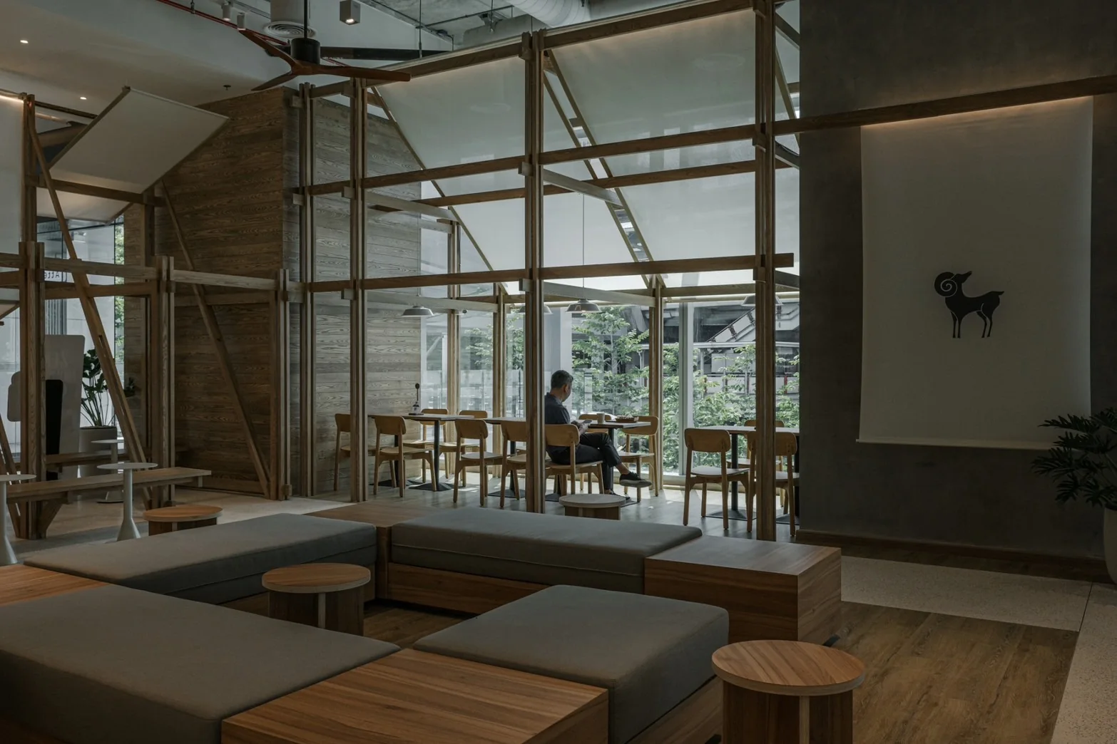 Lounge seating framed by timber and daylight