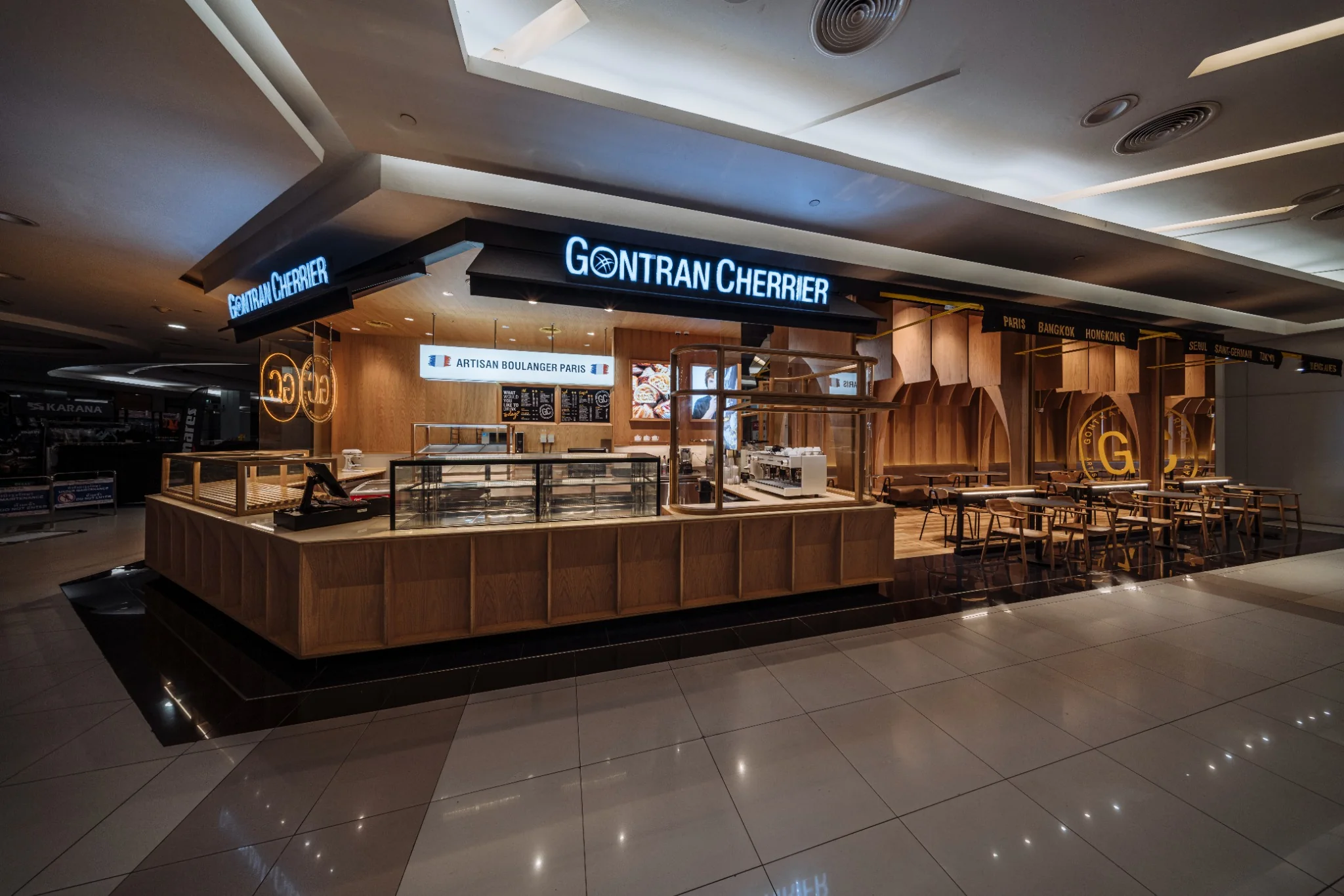 Timber arch framework organizing the Gontran Cherrier bakery interior
