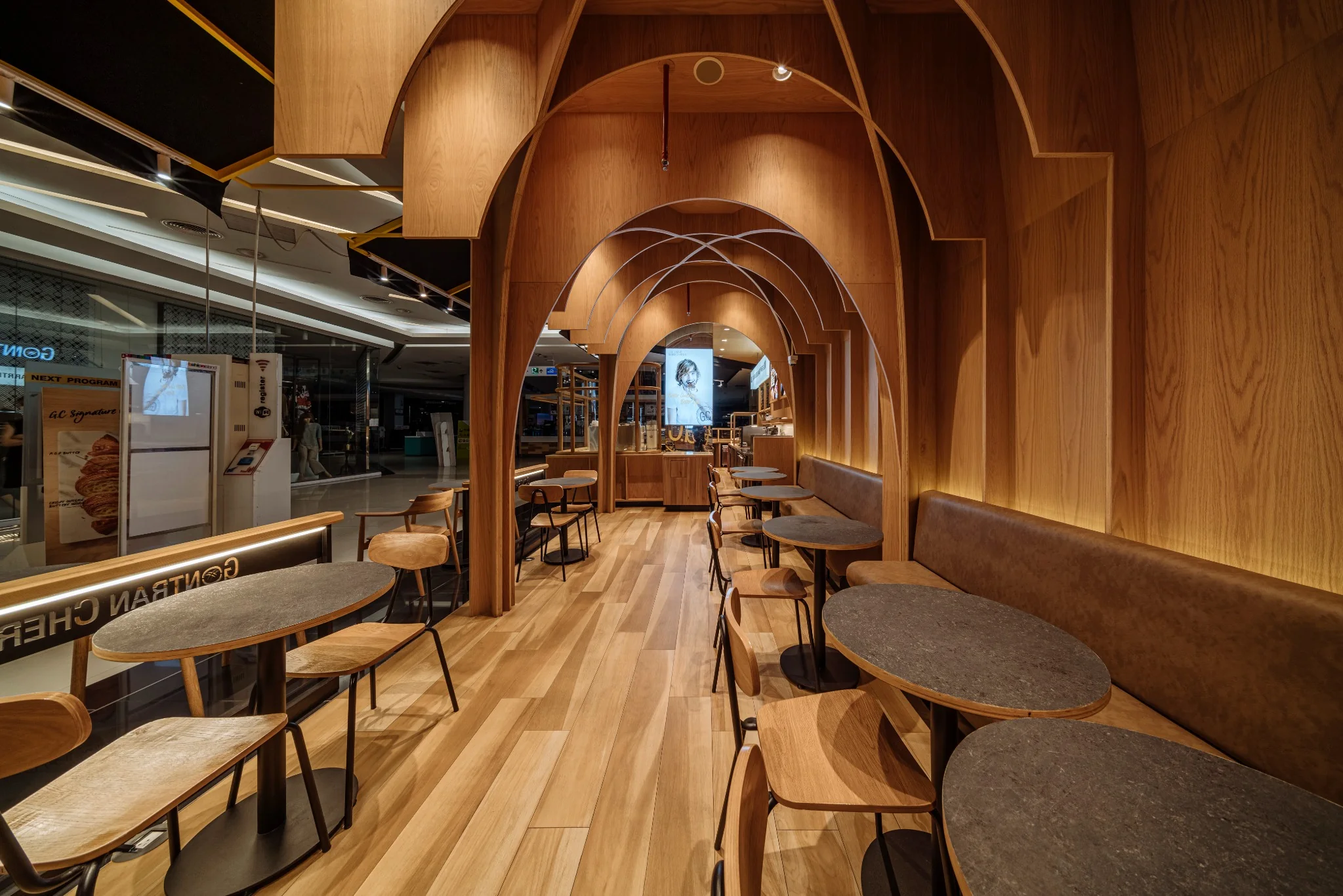 Bakery counter integrated into the timber spatial framework