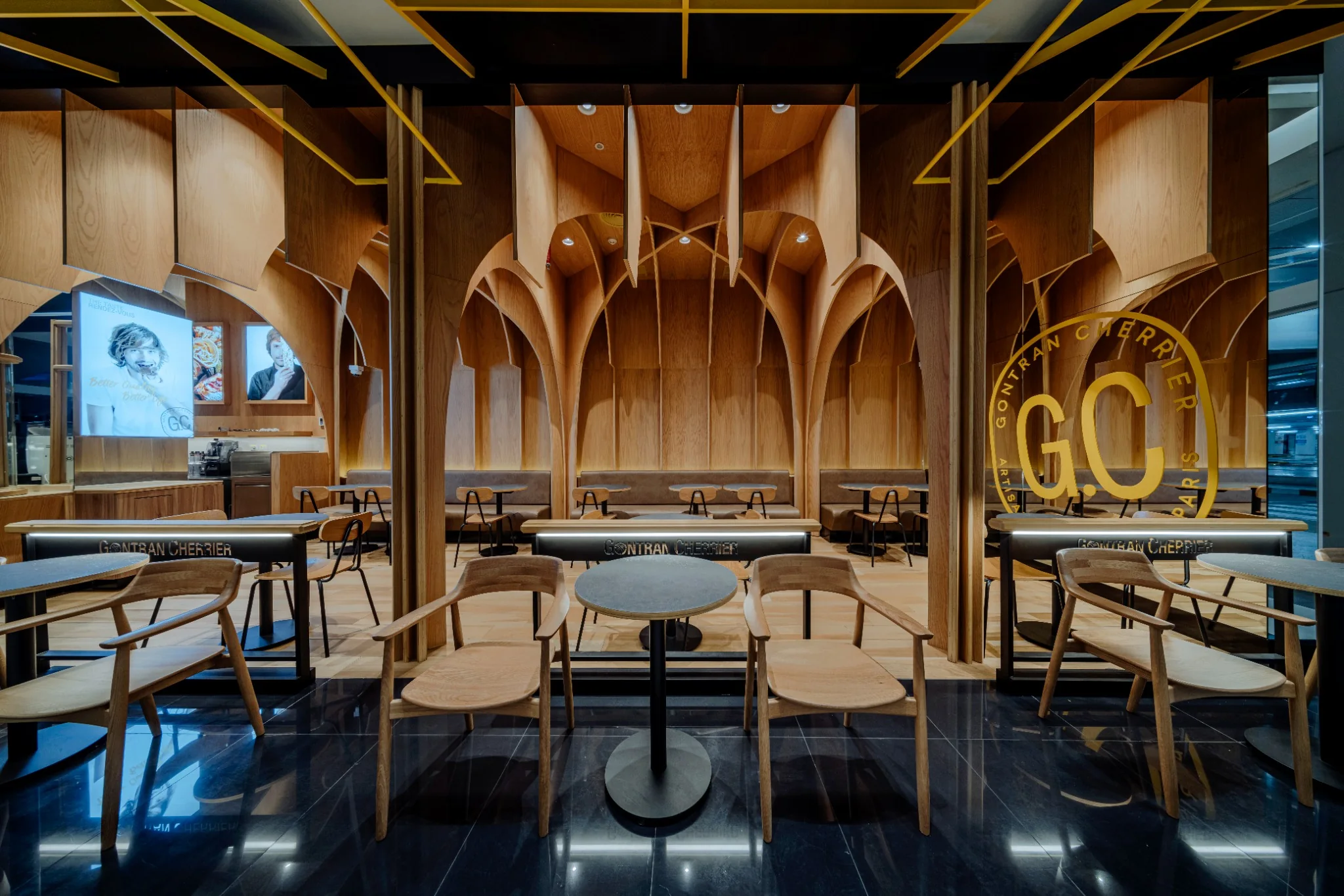 Cafe interior detail showing repeated timber geometry