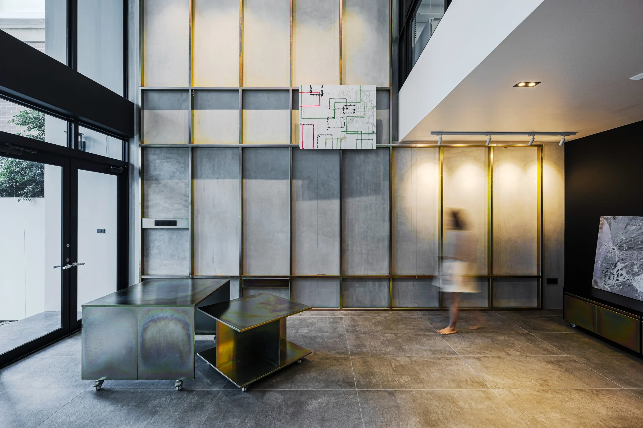 Indy's Scape double-height house gallery with iridescent movable furniture by SpaceLAB Architects