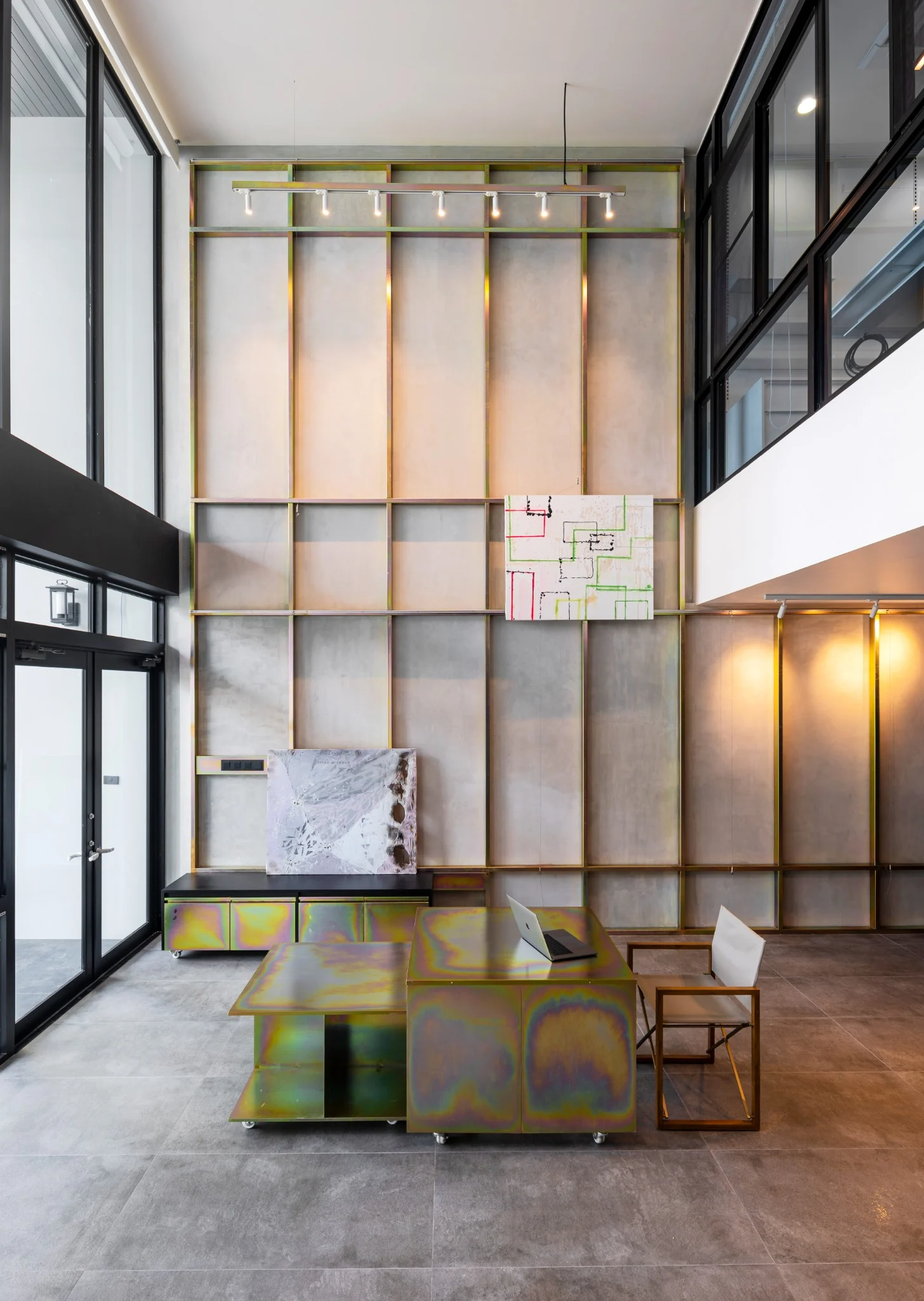 Indy's Scape gallery wall and custom iridescent metal furniture