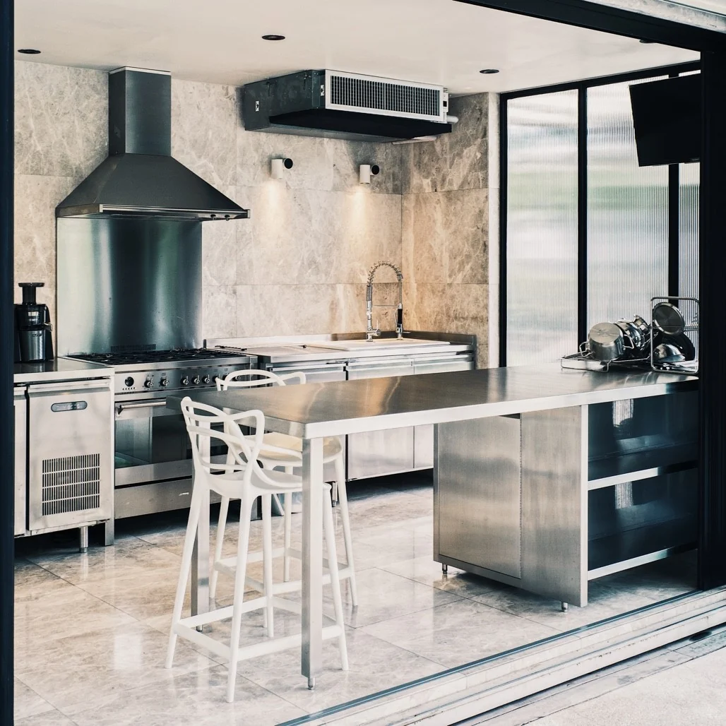 Kitisook House kitchen viewed through fully opened folding doors