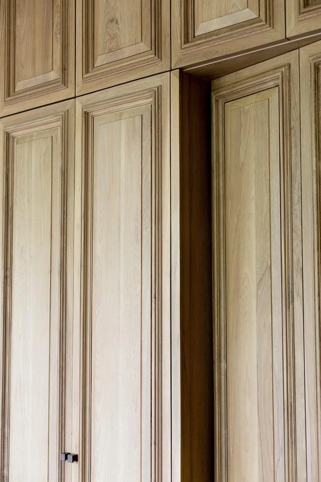 Detailed timber cabinet panels at Kitisook House