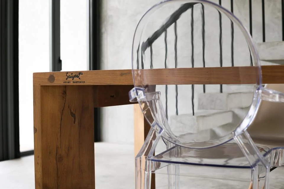 Acrylic chair and timber table detail