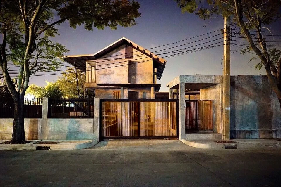Street elevation of Kitisook House at dusk