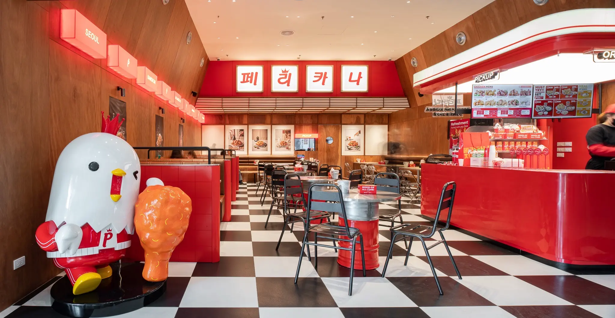 Pelicana WestGate interior with mascot and dining area