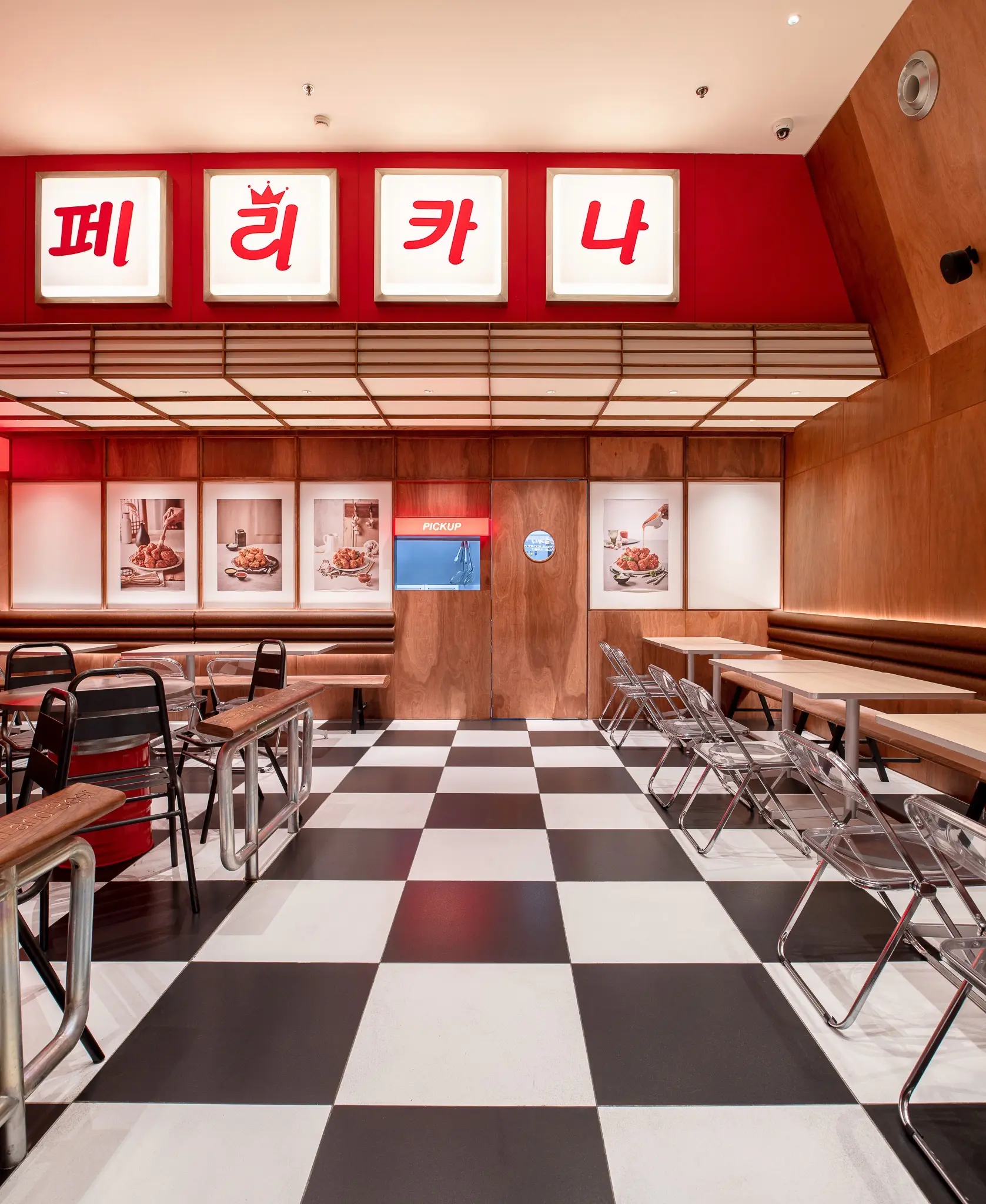 Pelicana WestGate dining aisle beneath Korean signage