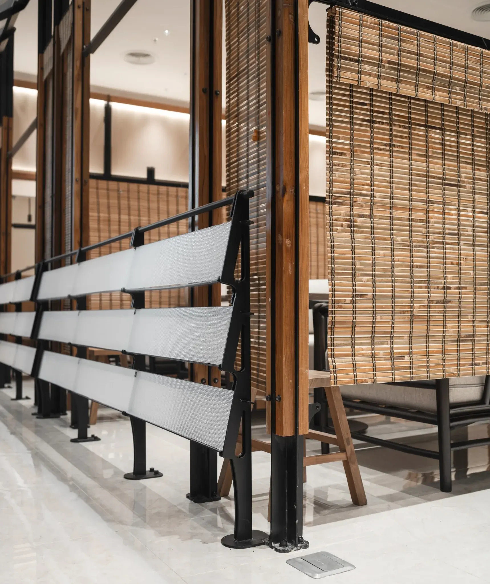 Woven screen and translucent lower panels integrated into the Ponn Future Park Rangsit perimeter