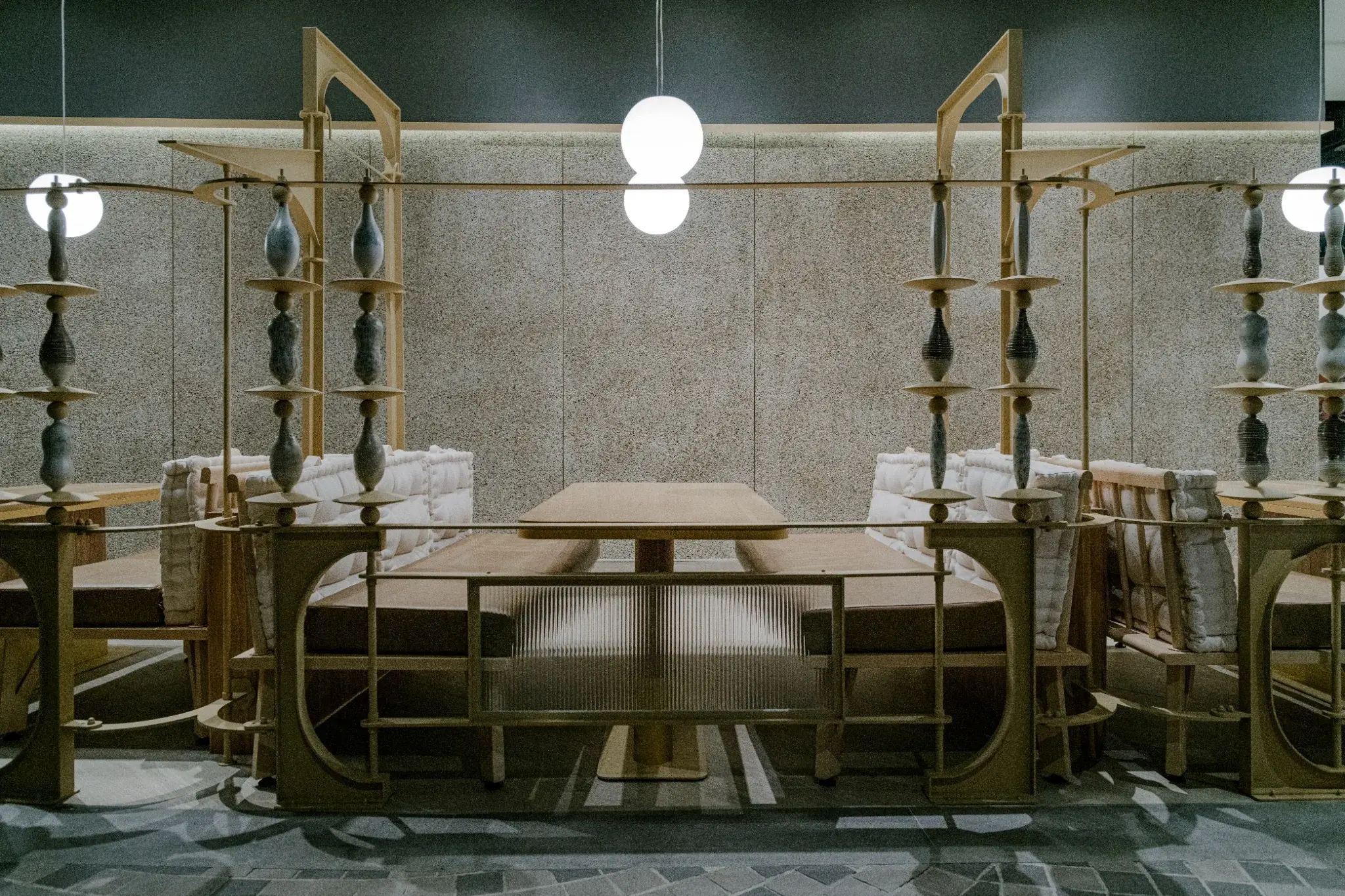 Frontal booth seating framed by custom metalwork at Ponn Terminal 21 Rama 3