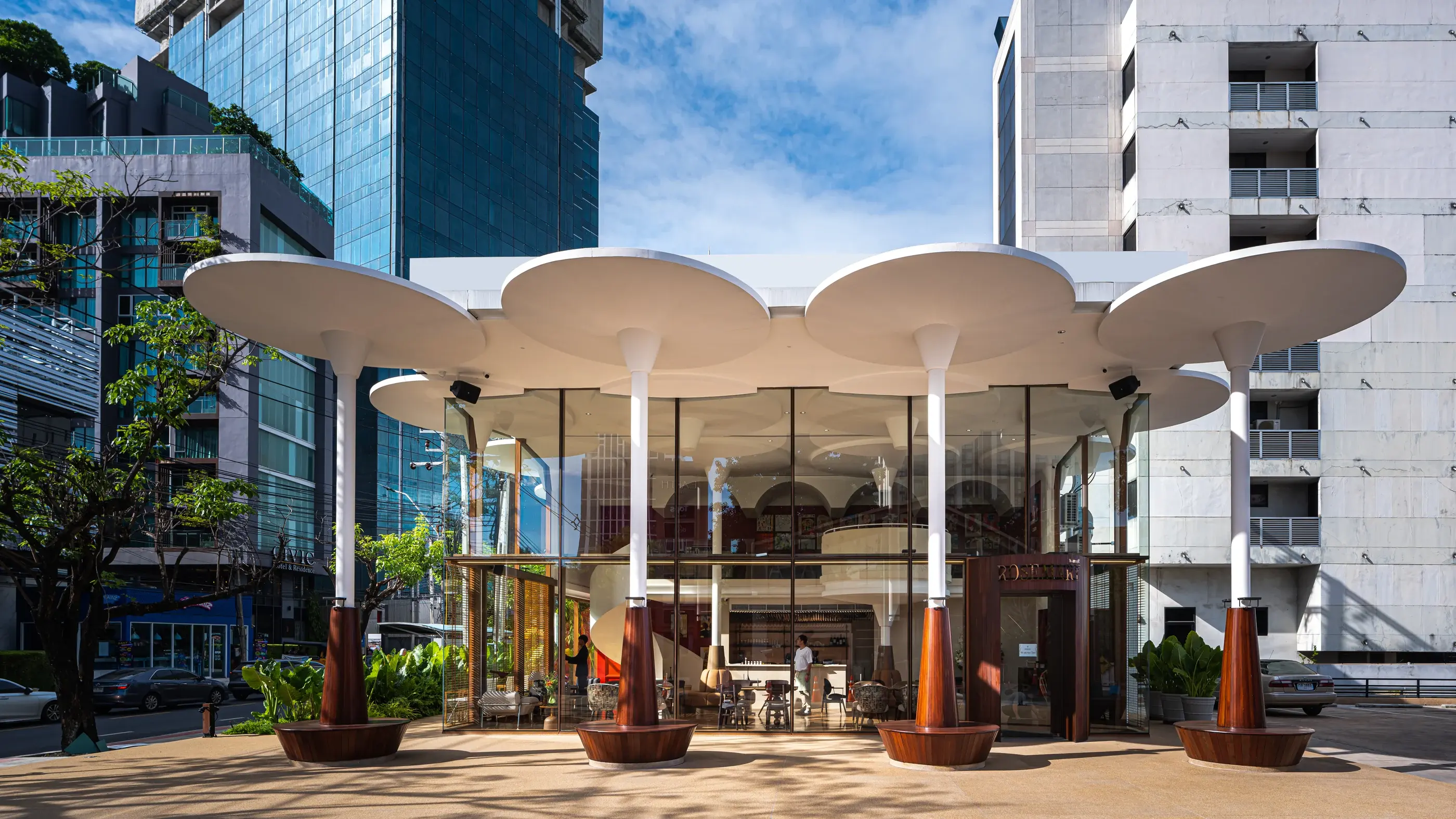 Daytime panoramic view of Rosemary Everyday Brasserie and its circular street canopy