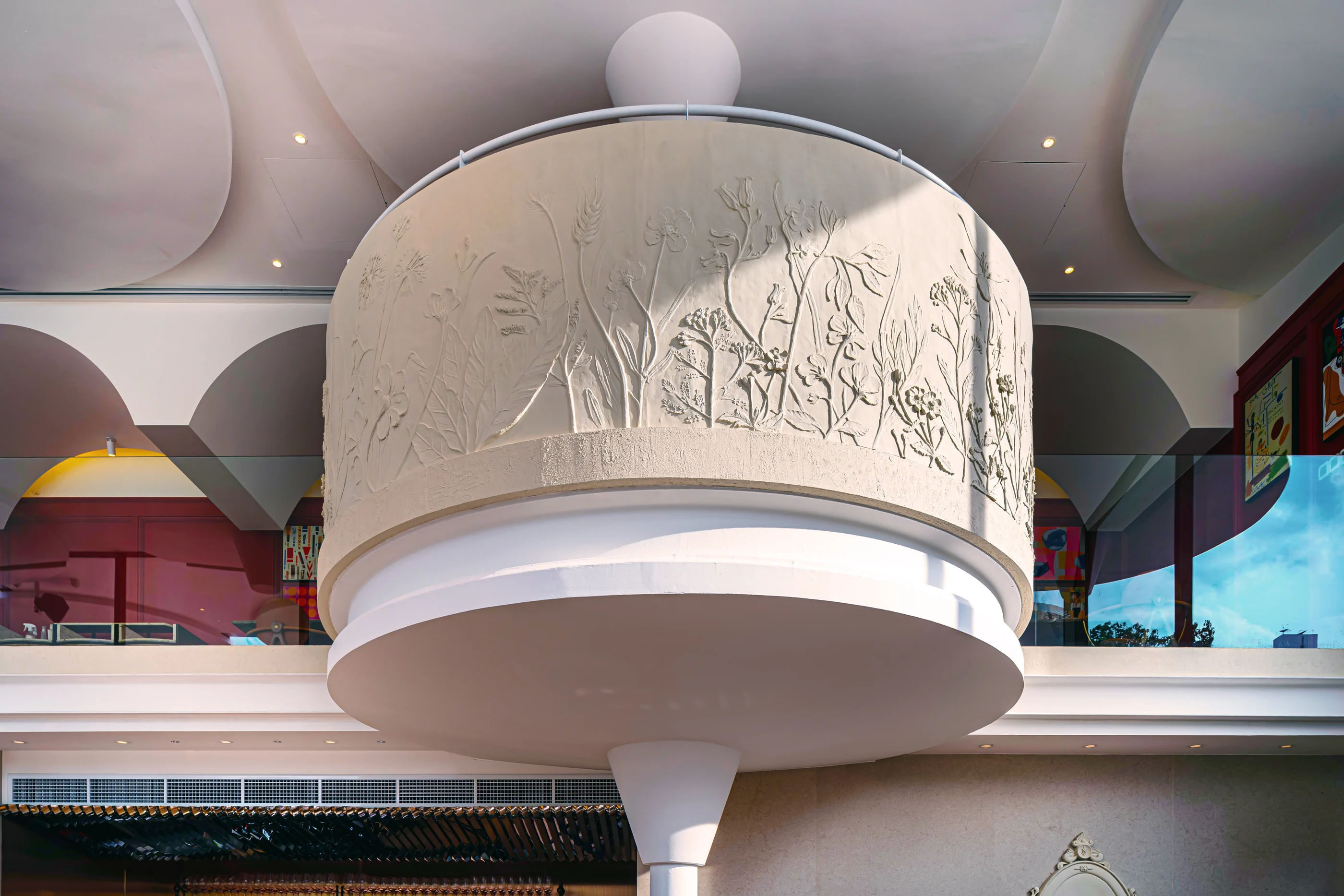 Close view of the hand-finished botanical plaster relief on Rosemary's mezzanine