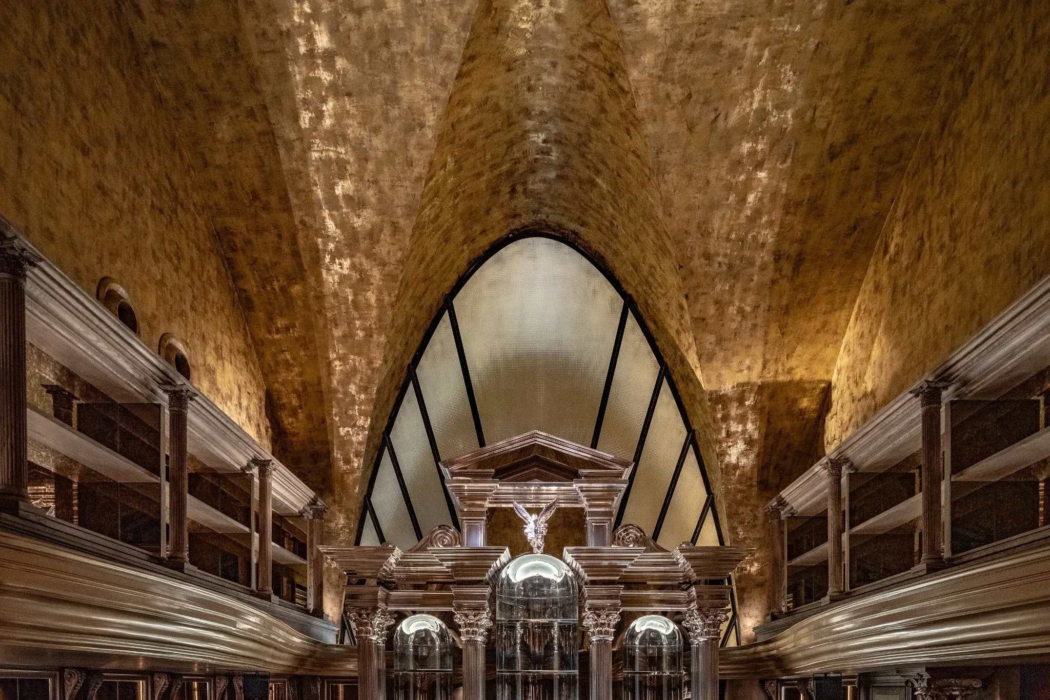 Gold-toned vaulted ceiling material detail at The Club
