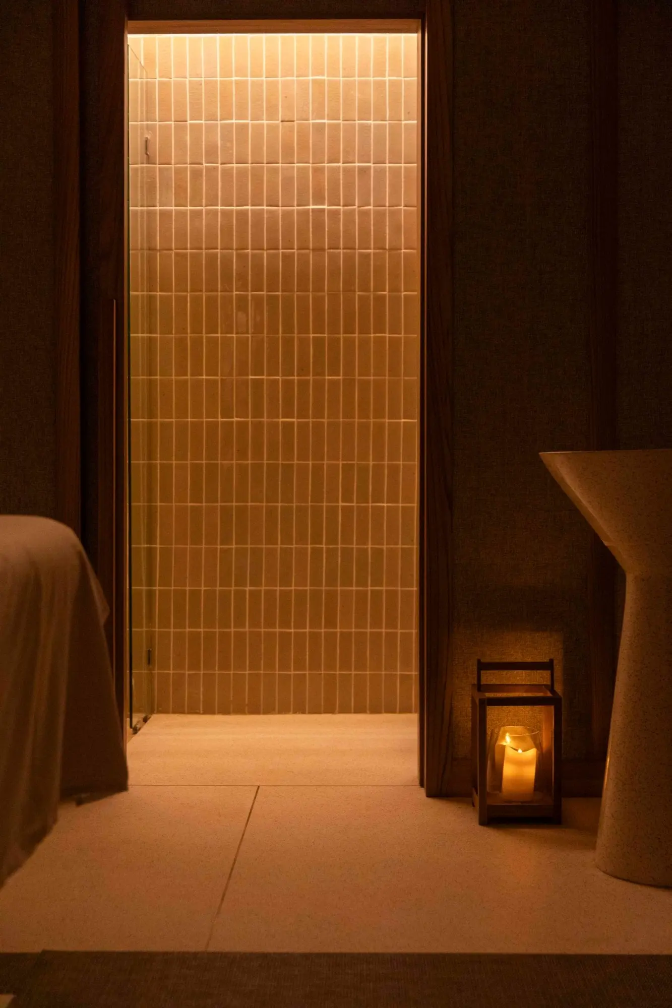 Warm tiled doorway and lantern at The Retreat Spa